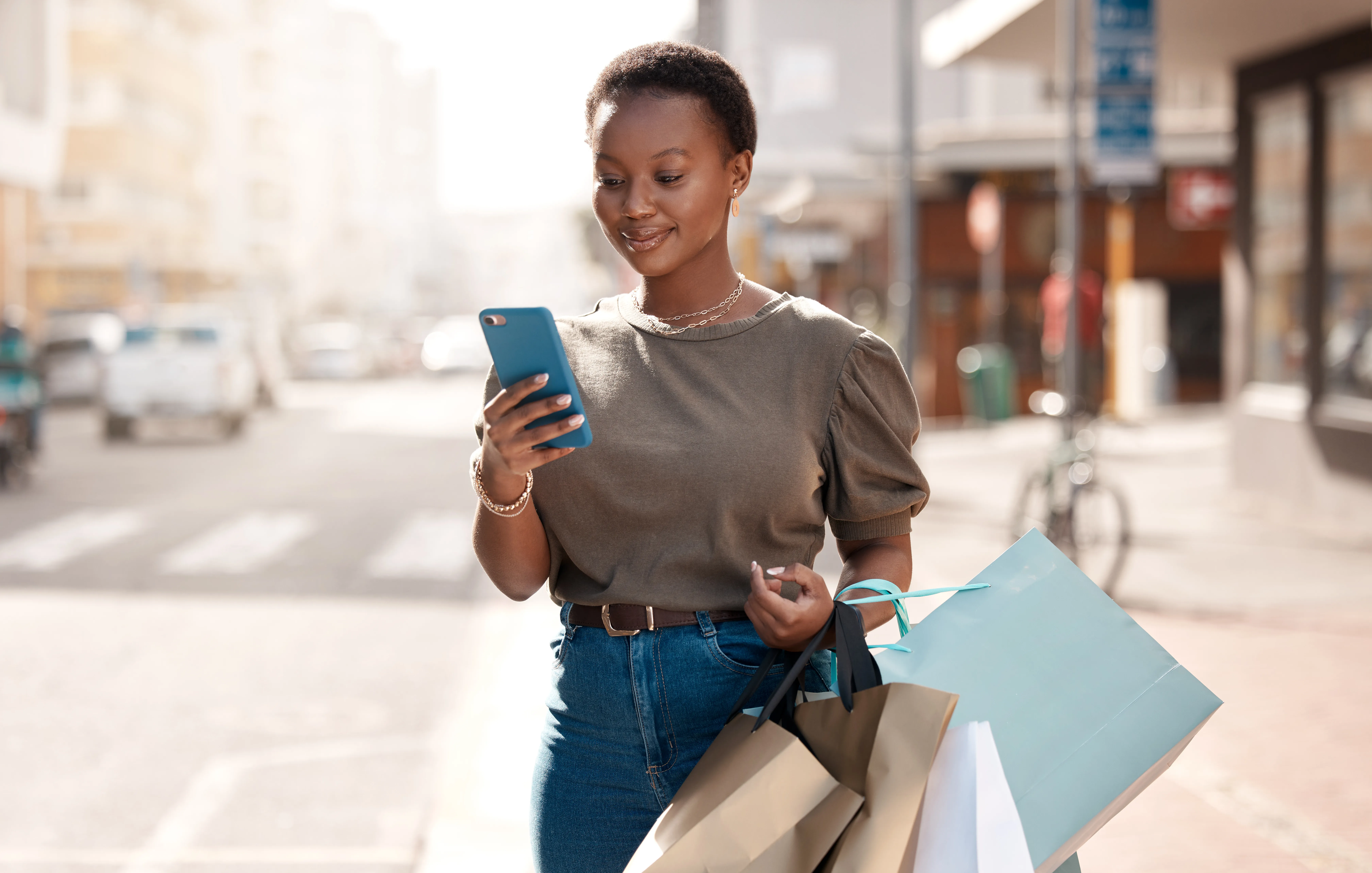 african american woman looking at phone