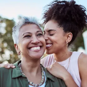 Older lady with younger lady smiling